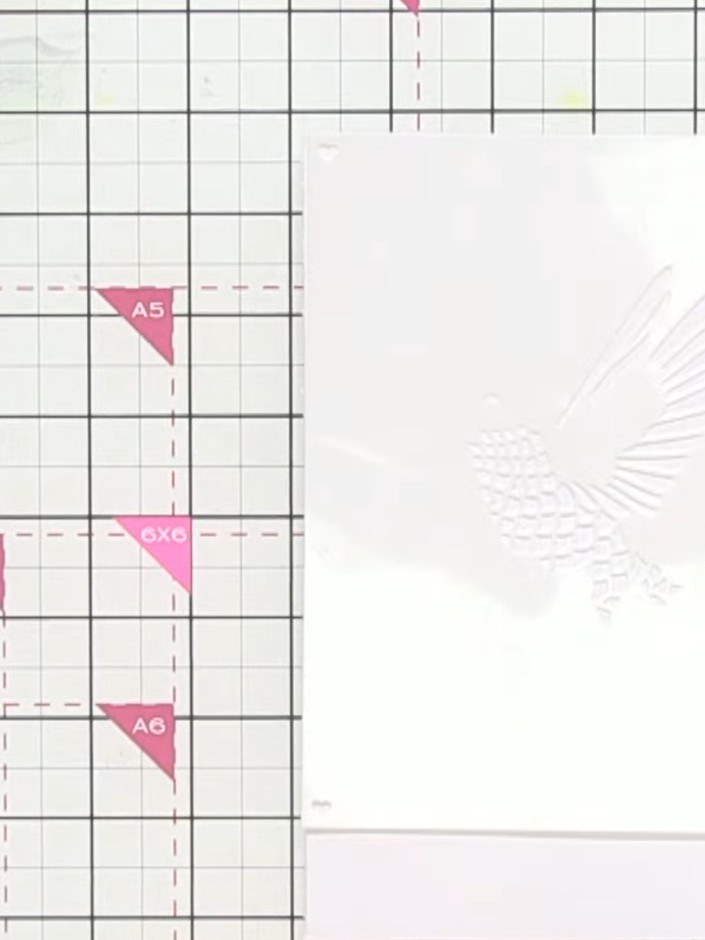 Step 2: Position stencil number one in the corner of your white card blank. Use the heart registration marks in the co