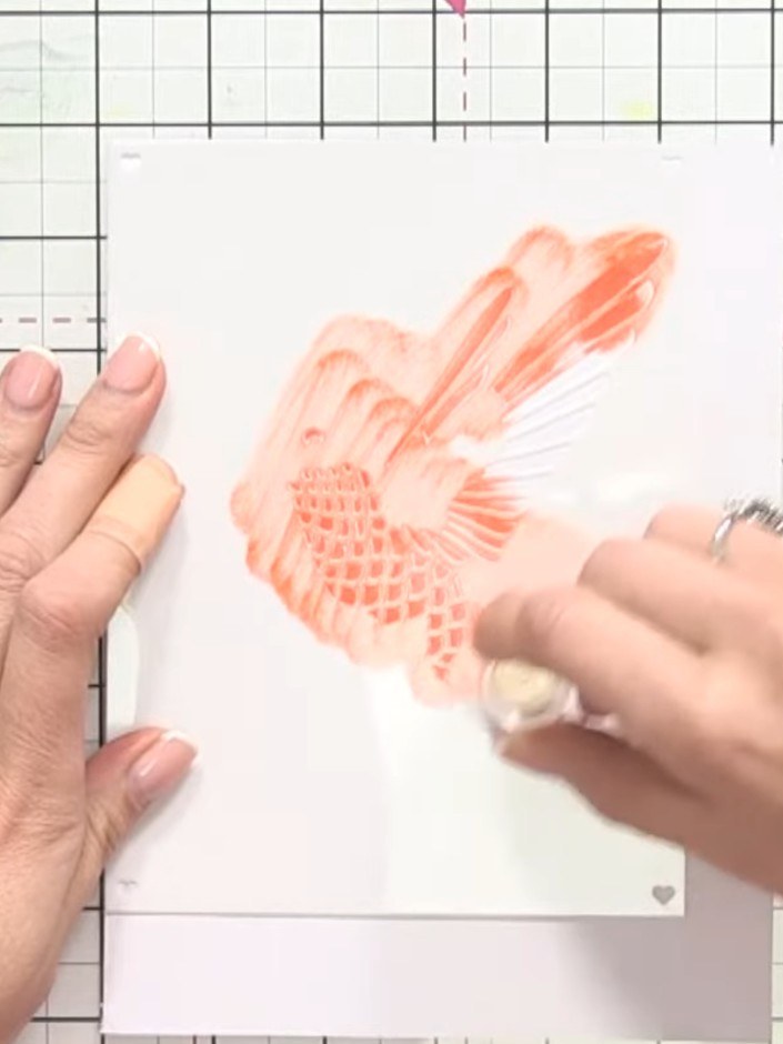 Step 3: Apply orange ink through stencil one using your sponge dauber. Work from light to dark, building up the colour