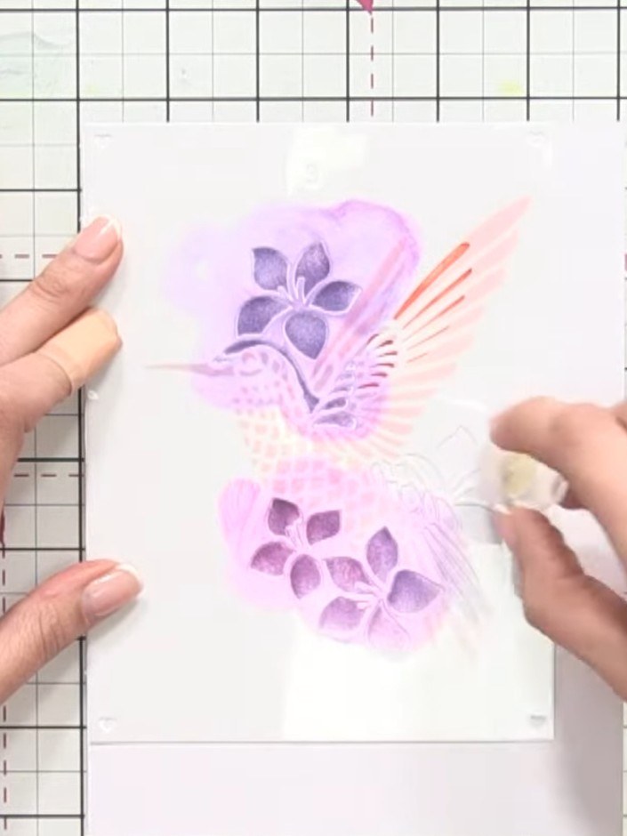 Step 5: Position stencil three over your design and apply purple or Fandango ink using a blending sponge. This adds de
