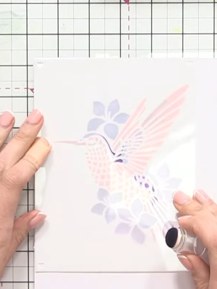 Step 6: Skip to stencil five and apply teal ink to the feather details on the hummingbird. Then return to stencil four