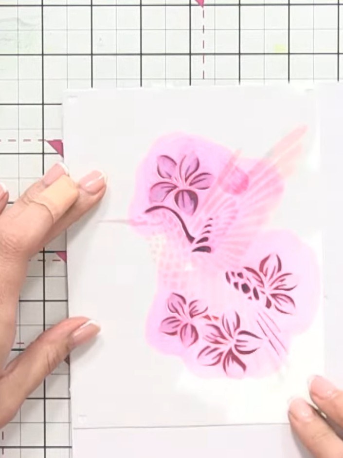 Step 8: Allow the pink stencilled paste to dry completely. Once dry, carefully lift and remove the stencil to reveal y