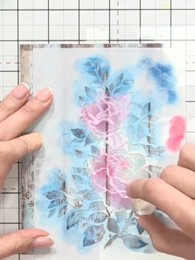 Step 6: Apply soft pink ink very lightly to the flower centre. Allow the pink to blend with the underlying teal to cre