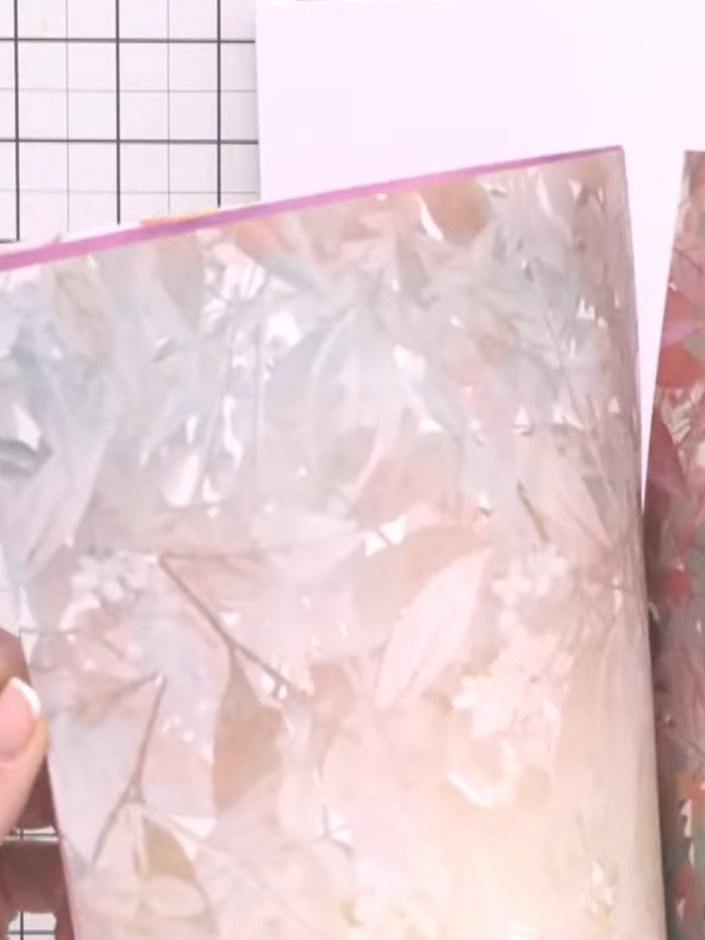 Step 1: Gather four pieces of A4 card in your chosen colour from the Delicate Flora paper pack. These will form the ba