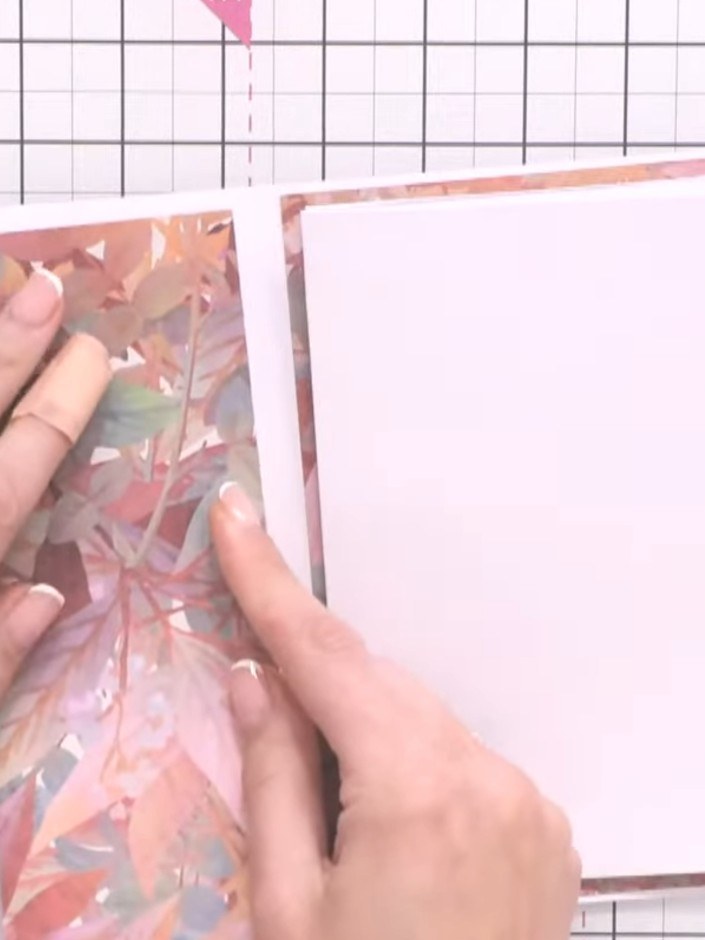 Step 15: Cut a piece of patterned paper to create a side pocket. Adhere it to the left side panel of the album, leaving