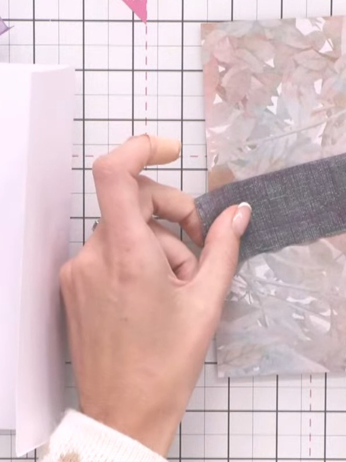 Step 9: Cut a length of ribbon long enough to wrap around the album and tie a bow. Leave extra length for the bow tail