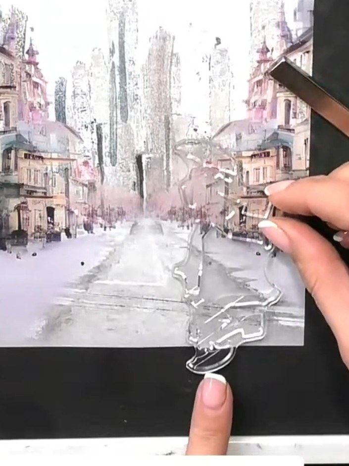 Step 4: Stamp the bicycle image onto the black card base, positioning it in the lower portion of the card beneath the 