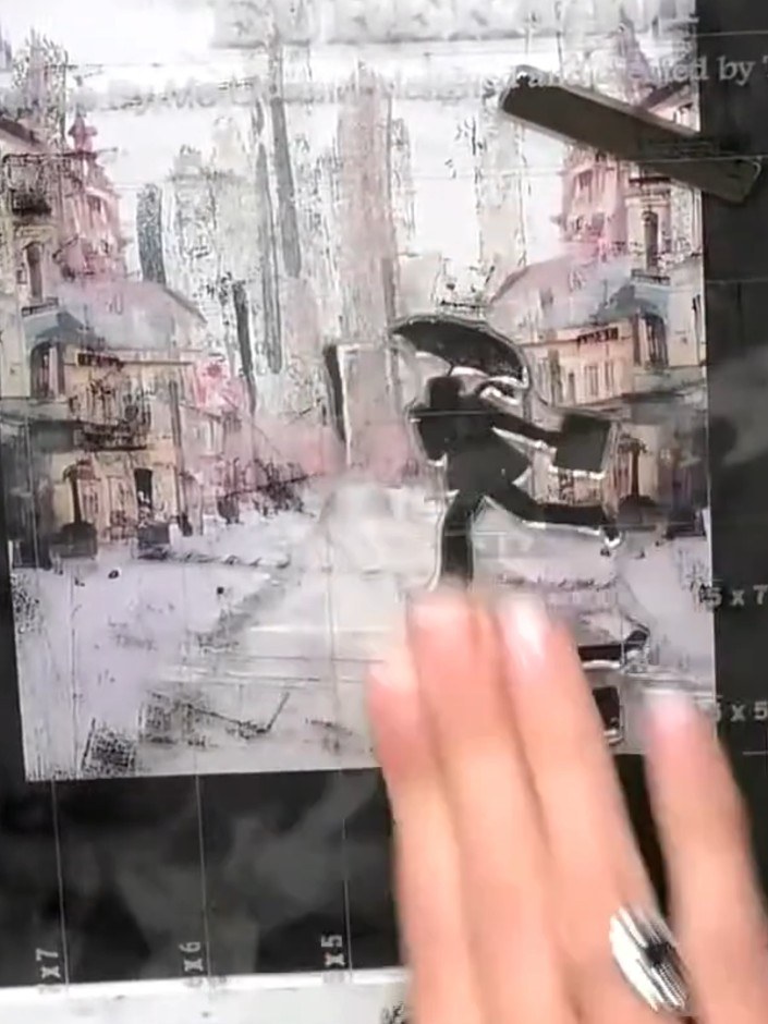 Step 5: Position the urban street scene stamp on your black card, noting that the reflection portion of the stamp is a