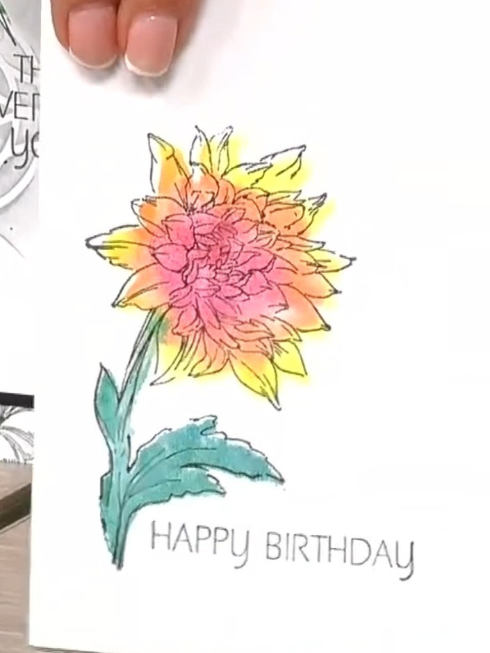 Step 4: Stamp the coloured flower image onto your white card or watercolour paper. Position the stamp carefully to ens
