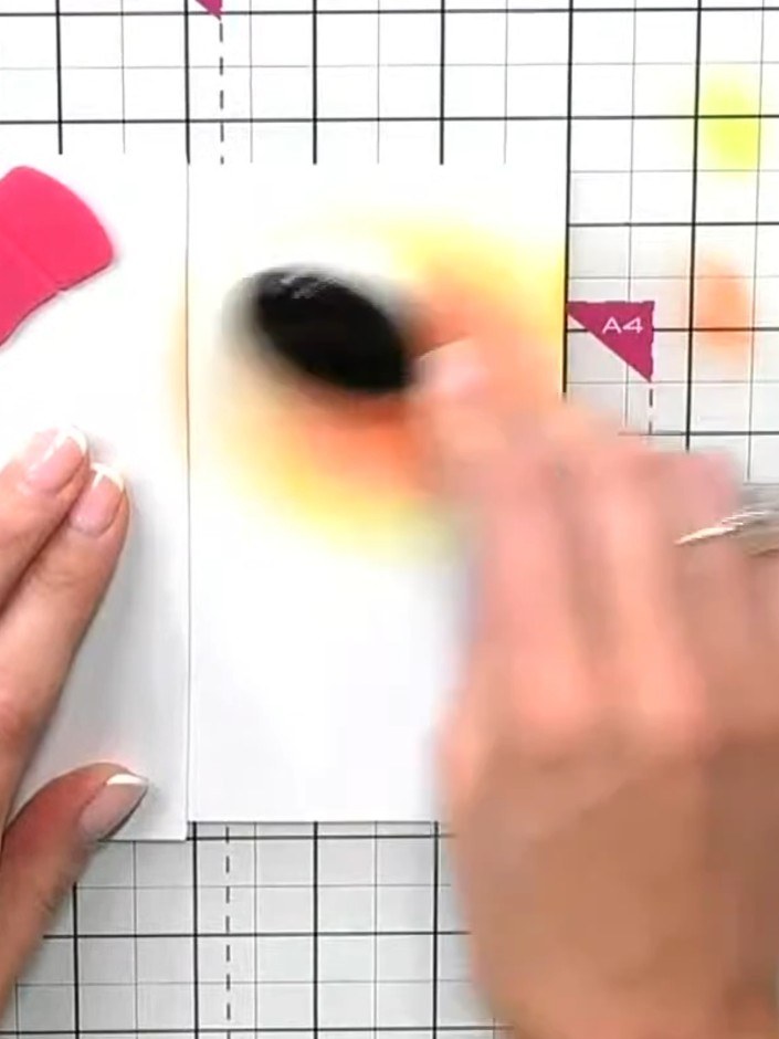 Step 5: Pick up yellow ink with your blending tool and blend it outward from the orange area to create a smooth gradie