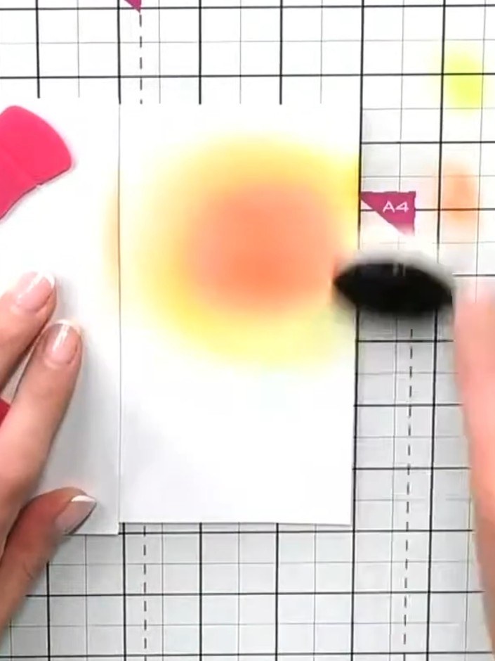 Step 7: Using a blending brush, apply blue ink around the outer edges of the card to deepen the atmospheric effect. Wo