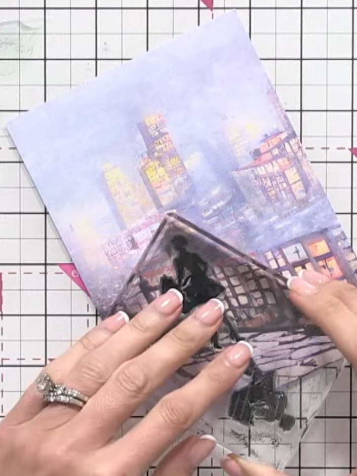 Step 3: Position the stamp at the edge of the paper so the figure appears to be walking into the scene. Place it parti