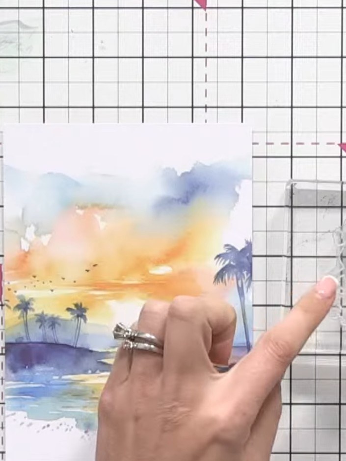 Step 2: Ink up the reflection stamp (showing silhouettes of people) using black ink. The stamp shows figures in variou