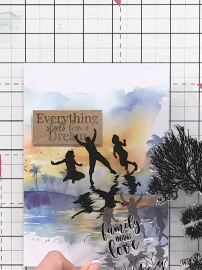 Step 6: Stamp the tree images from the reflection stamp set onto your card using black ink. Position the trees at the 