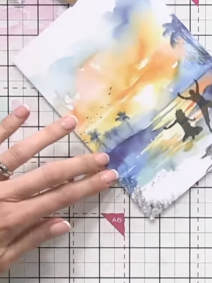 Step 9: Mount the finished watercolour panel with the stamped silhouettes onto a coordinating card blank to complete y