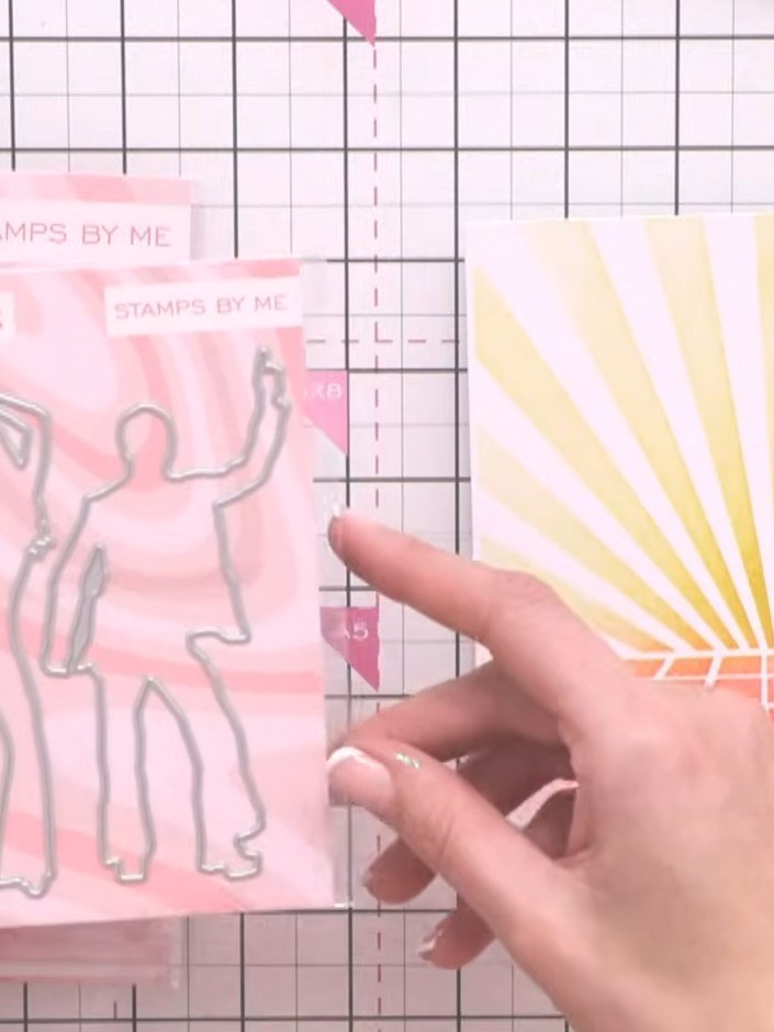 Step 6: Die cut the dancing figures from the Happy Feet stamp and die set. Use glitter card or patterned paper for a d