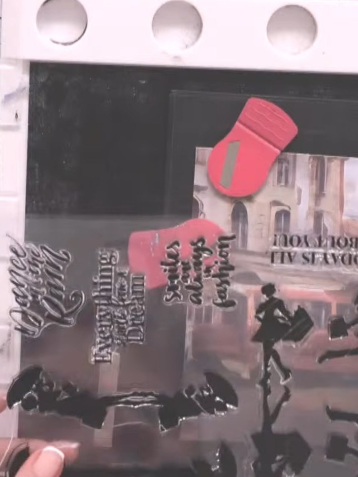 Step 1: Select a piece of Urban Life paper featuring a street scene design. Position the paper on your black card base
