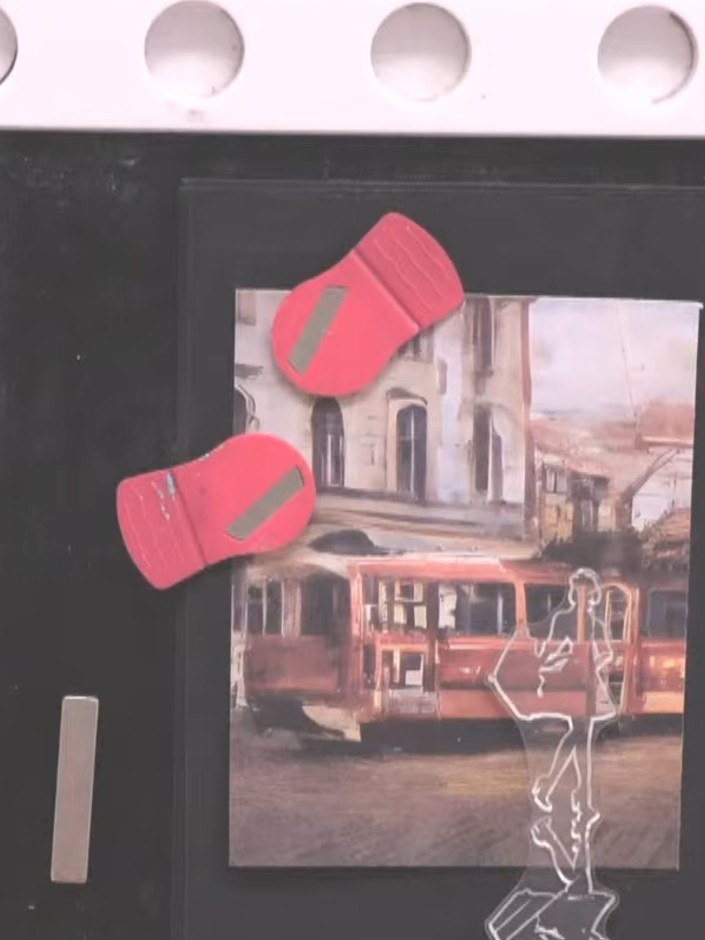 Step 2: Select a stamp from the Reflection Collection that complements your urban scene. The lady with umbrella design