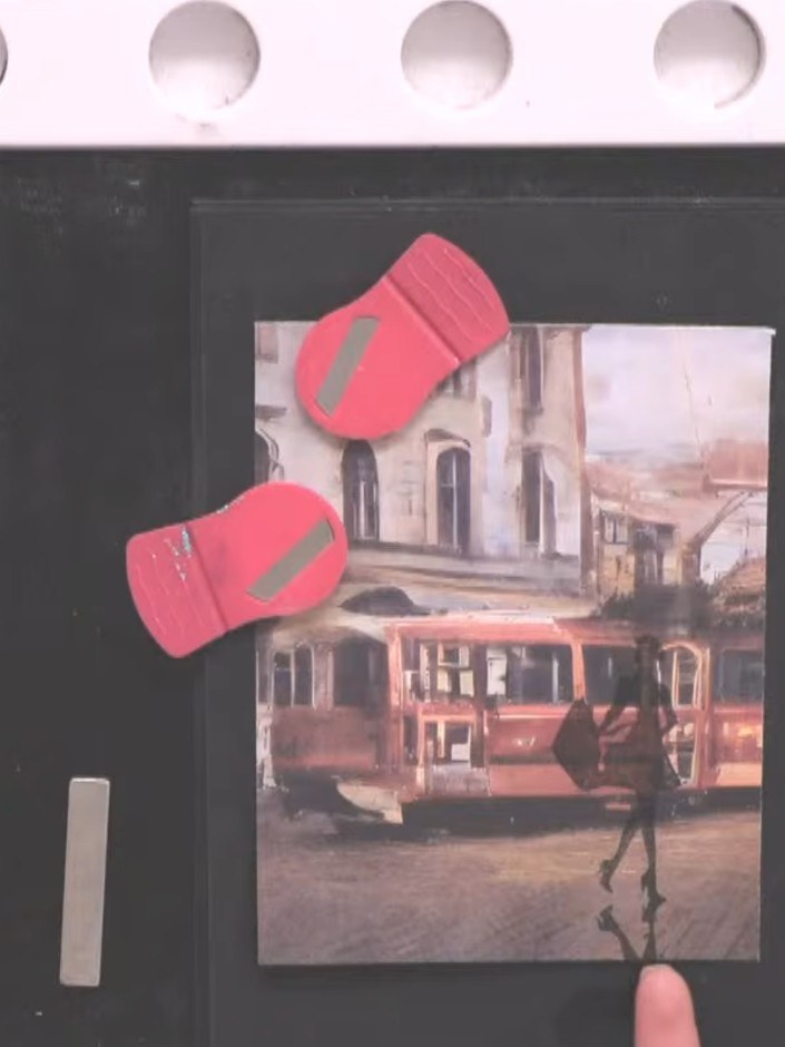 Step 4: Position the Eureka 101 stamp on your paper, aligning it with the street scene image. Stamp only the lower por