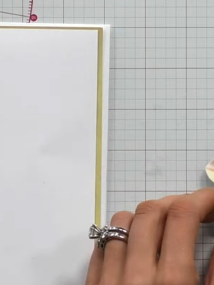 Step 10: Add embellishments such as gems or additional decorative elements to complete your foliage banner card. Positi