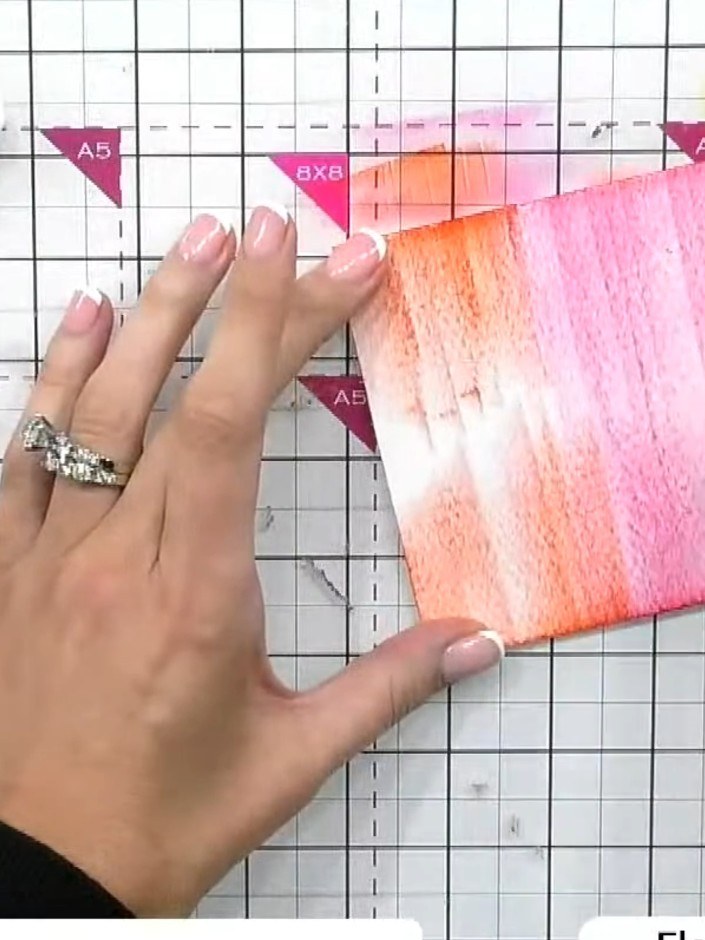 Step 3: Swipe the yellow ink pad along the bottom edge of the inked card panel, blending it upwards into the pink and 