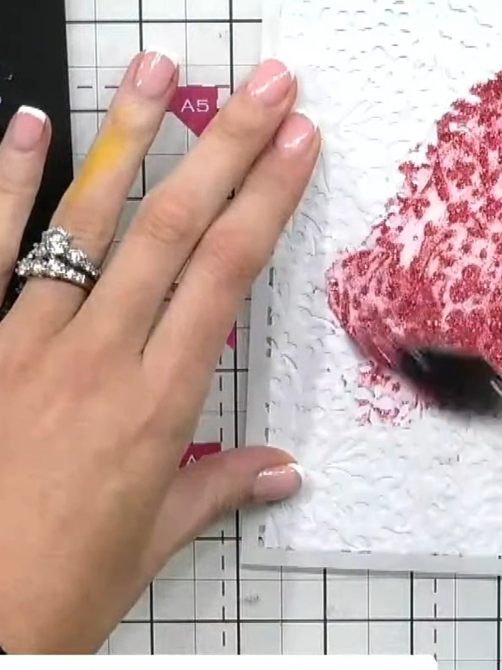 Step 2: Spread the coloured paste (such as 'Party Dress' with pink and gold tones) through the ditsy floral stencil us