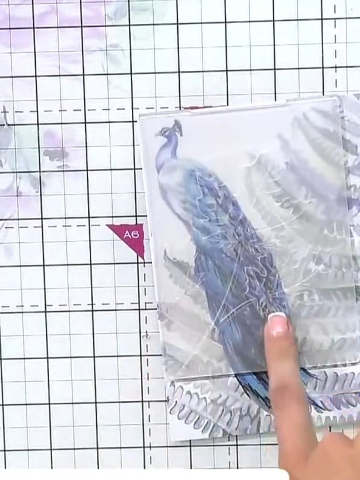 Step 1: Place the painted mount into the leaf embossing folder, ensuring it is positioned centrally within the folder.