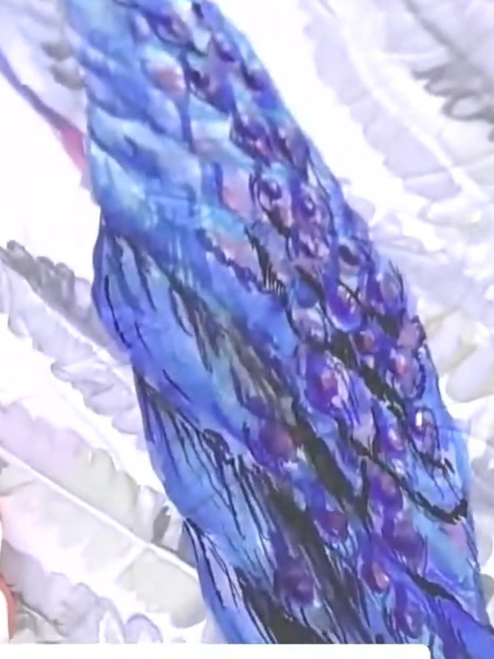 Step 3: Take a purple ink pad and swipe it over the embossed leaf area to bring the detail to the foreground. Work the
