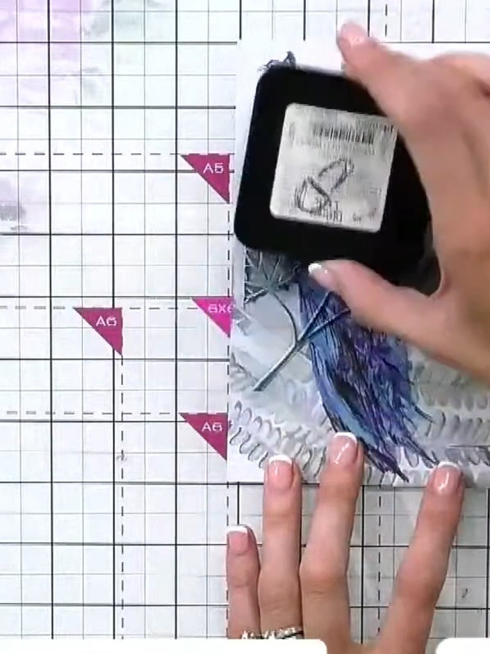 Step 6: If the peacock design becomes too dark, take a white ink pad and swipe it over the area to lighten the colour 