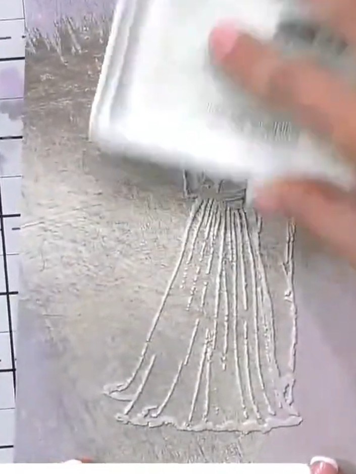 Step 7: Spray the inked area lightly with water to create a watercolour wash effect. The water will blend and soften t