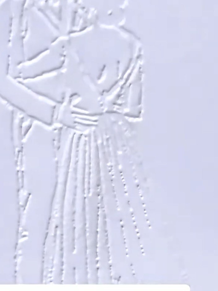 Step 9: Apply white ink around the embossed figure to highlight the design and bring it forward. Use the ink to create
