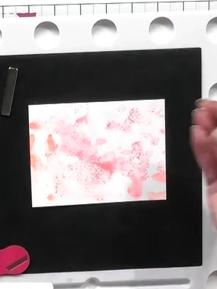 Step 3: Take a piece of watercolour card and apply concentrated watercolour pigment in pink shades. Dab and squish the