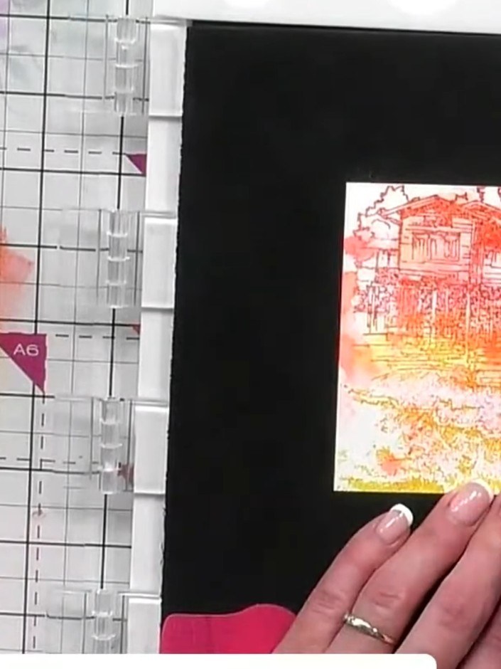 Step 5: Add a little water to the stamped image and use a brush to drag and blend the ink colours together, working th