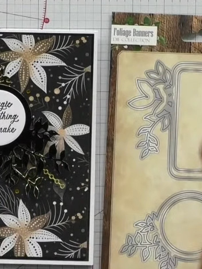 Step 3: Arrange the black and gold foliage die-cut pieces on the embossed black card base, positioning them around the