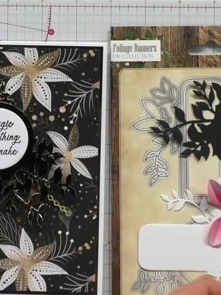 Step 5: Klebe die Laubteile mit transparent trocknendem Kleber auf die Karte. Layer the black and pink die-cut foliage elements 