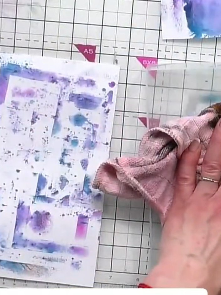 Step 6: If desired, use the stencil frames to mask off areas of your printed background. This creates crisp white bord
