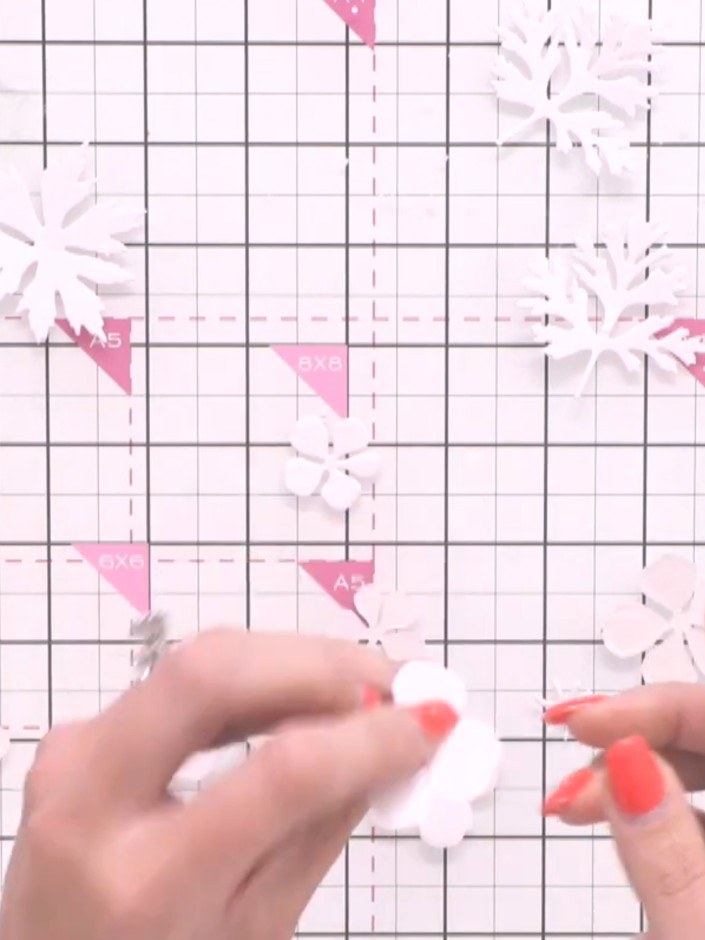Step 2: Turn over the largest white flower piece. Apply a light coverage of pink ink to the back using a blending brus