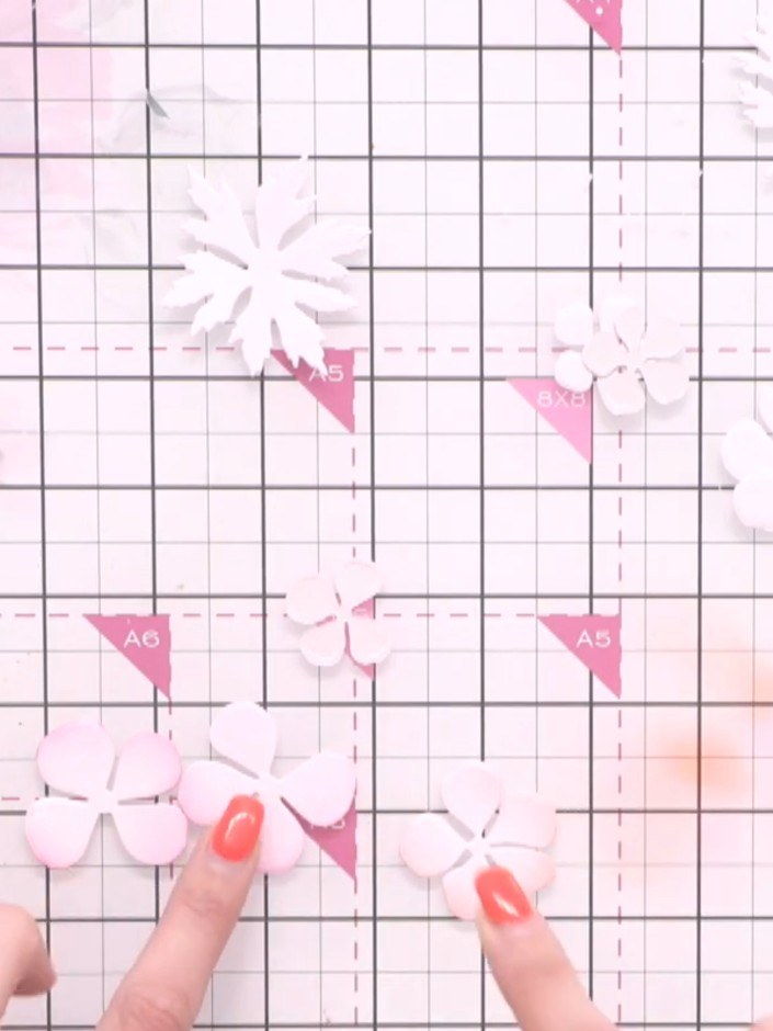 Step 3: Tap off the excess ink from the flower petals. Add a touch more ink to the petal ends for subtle shading, crea