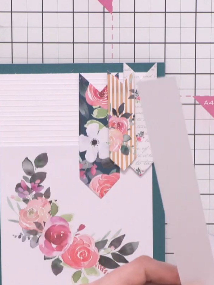Step 10: Add sparkle to the flowers using a glitter pen, applying it lightly to the pink roses and floral elements to a