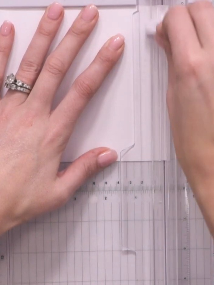 Step 4: Take your white card layer and use a score tool to create horizontal score lines across the top portion of the