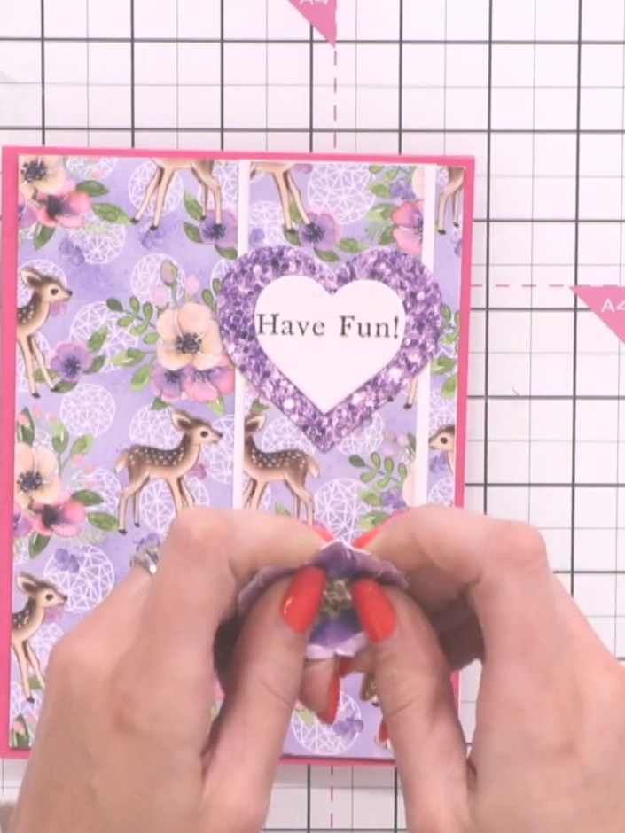 Step 10: Gently break down and separate the fibres of the fussy-cut purple flowers with your hands to give them texture