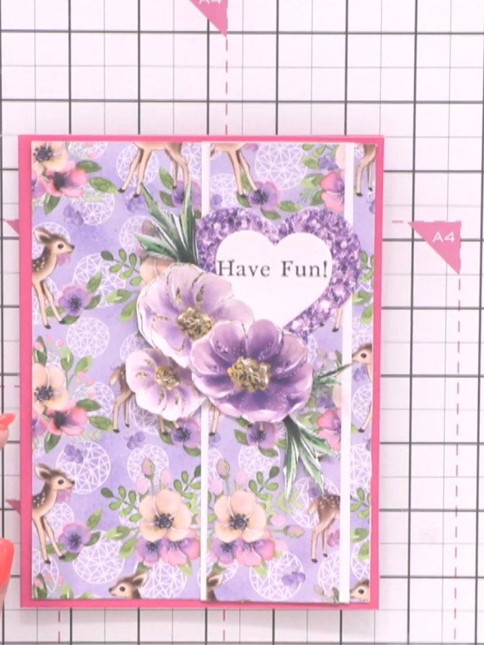 Step 12: Add a touch of sparkle to your finished card if desired. The completed card features a pink cardstock base wit