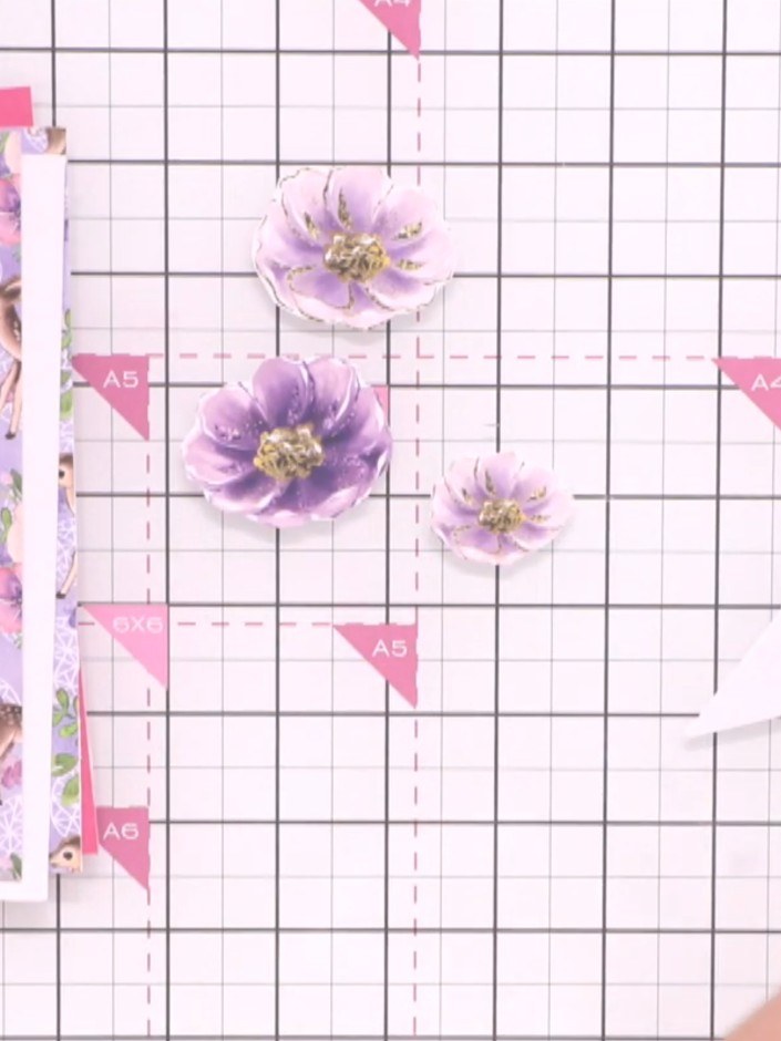 Step 4: Select leftover fussy-cut leaves and foliage elements from your decorative paper sheets to use as additional e
