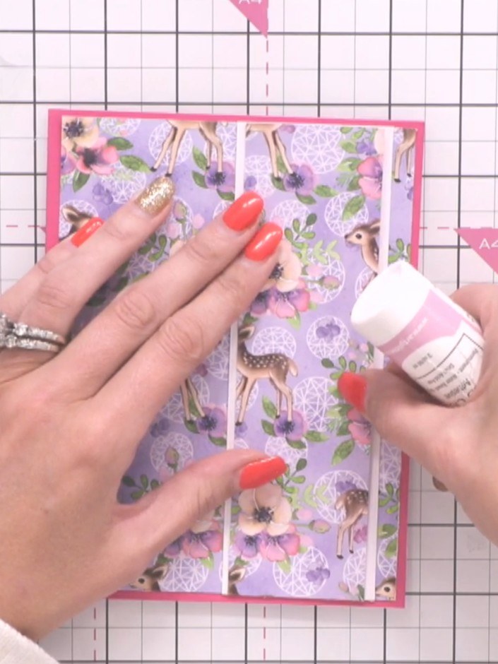 Step 7: Take an off-cut from the patterned paper and position it down the centre of the card front, creating a vertica