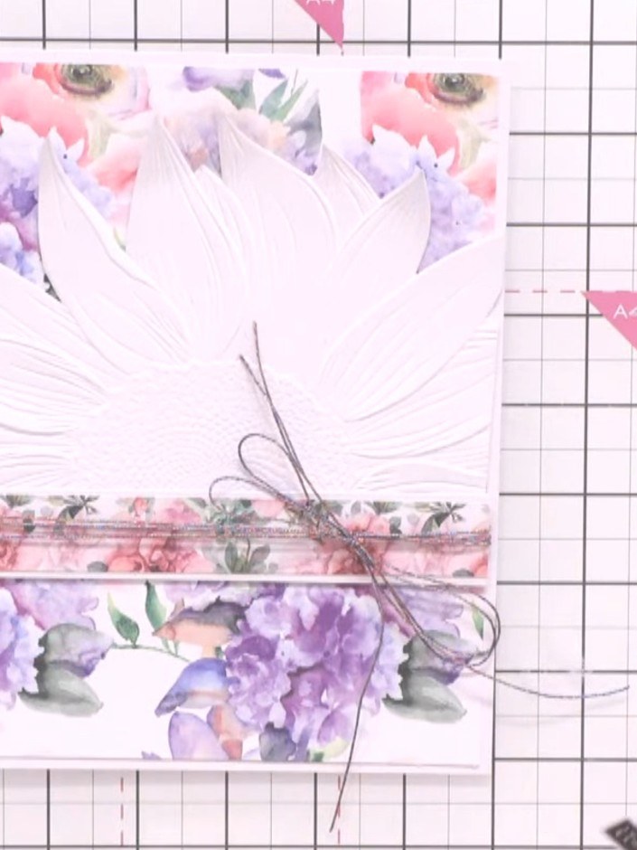 Step 12: Add a sentiment using washi tape, positioning it near the bow. Tuck the tape neatly to create a finished look 