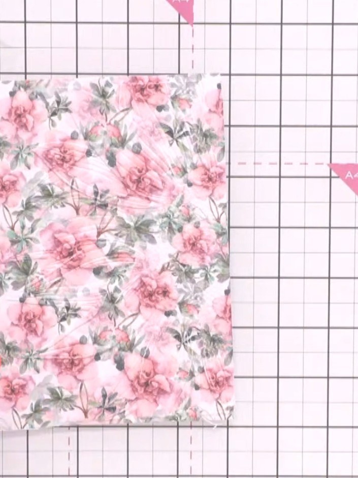 Step 2: Ink a pink ink pad across the embossing folder in several directions, ensuring you cover all the raised and re