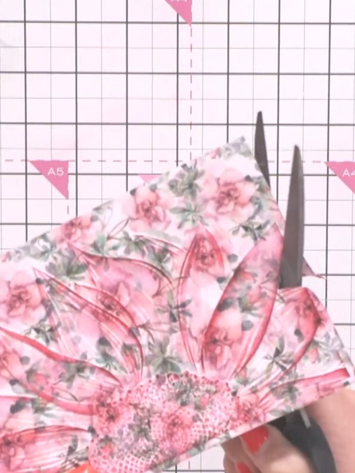 Step 3: Carefully fussy cut around the watercolour floral design using scissors, trimming away the background to creat