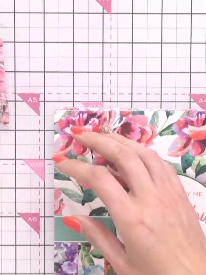Step 4: Select a complementary floral patterned paper from your pad and position it on your craft mat ready for trimmi