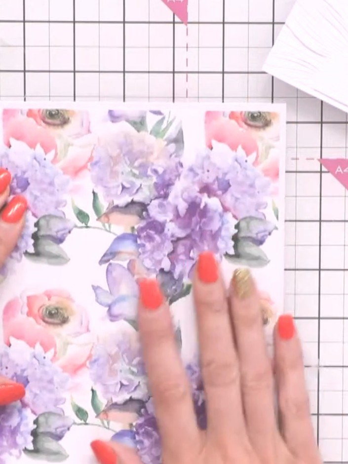 Step 9: Apply glue to the back of the patterned paper and adhere it to the top of the card base, aligning it with the 