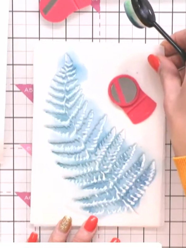 Step 2: Apply teal ink through the fern stencil using a blending brush, working the colour into all the recesses to cr