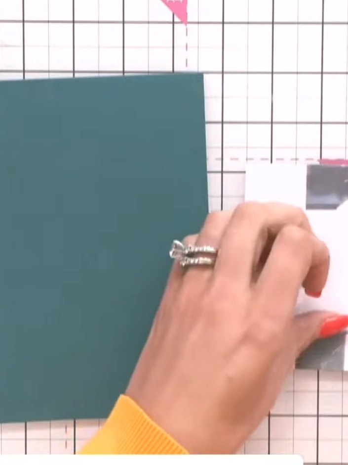 Step 7: Turn the card over and secure the vellum wrap at the back using a tape pen, applying adhesive around the edges